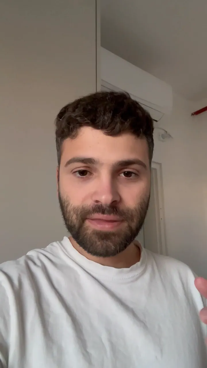 A raw selfie take of a man talking to his phone about customer feedback, with no captions or graphics.